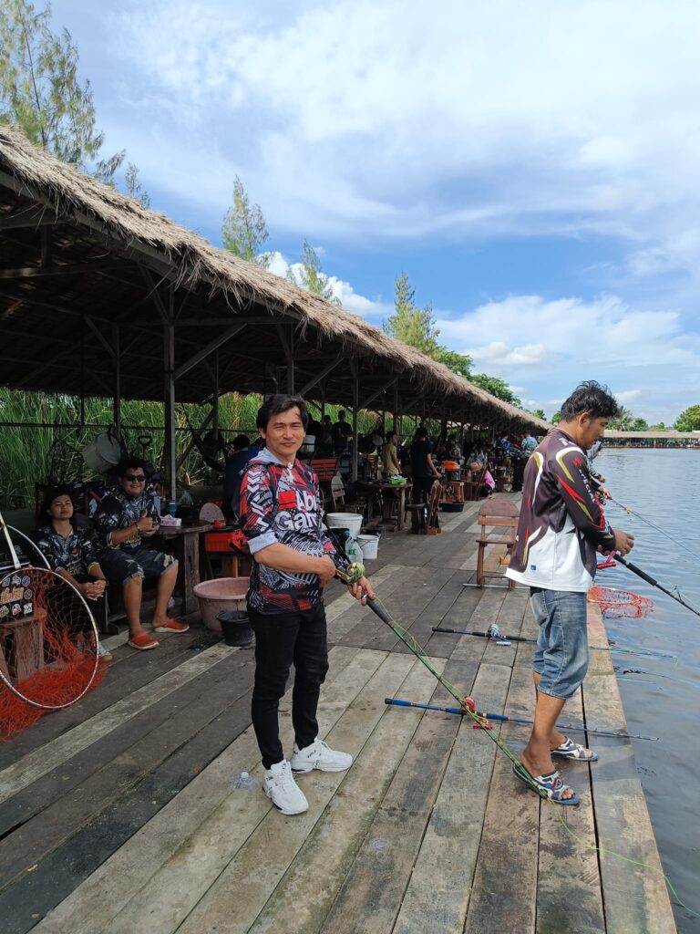 The thrill of casting a fishing line at New Bungsamran fishing lake, Bangkok, Thailand.