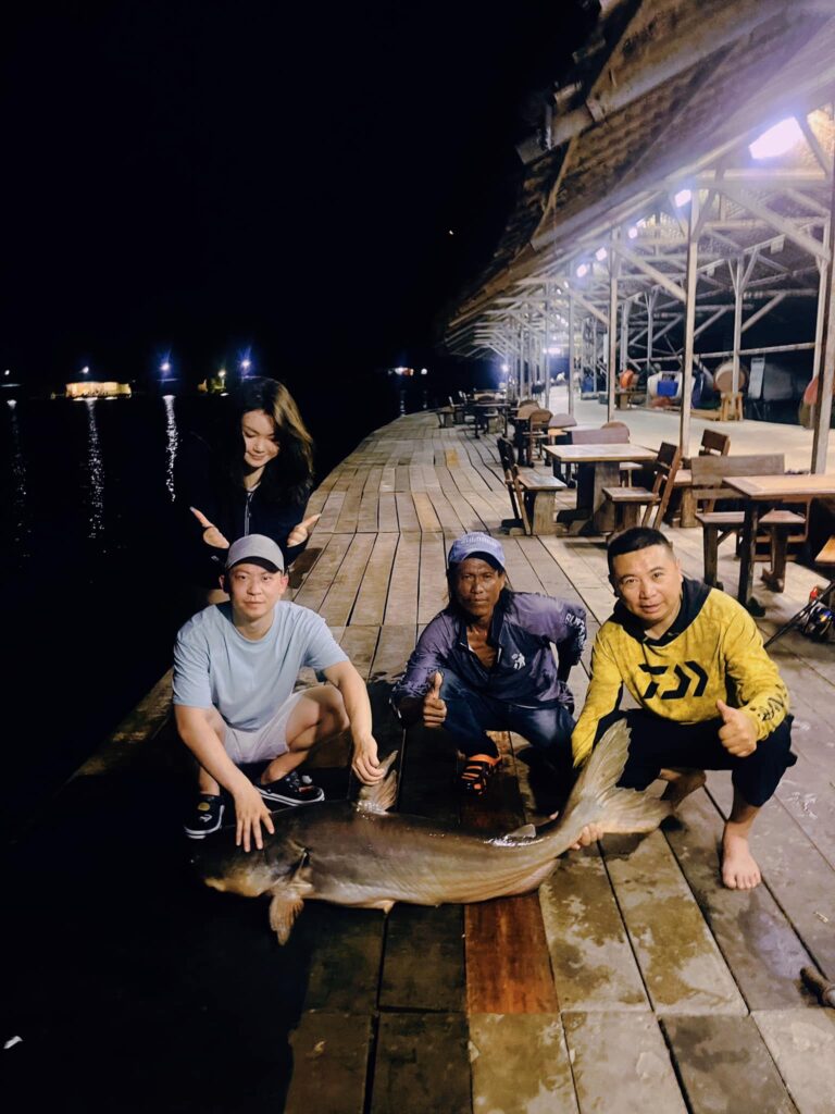 Enjoy the fun of night fishing at the expansive New Bungsamran fishing lake, Bangkok, Thailand.