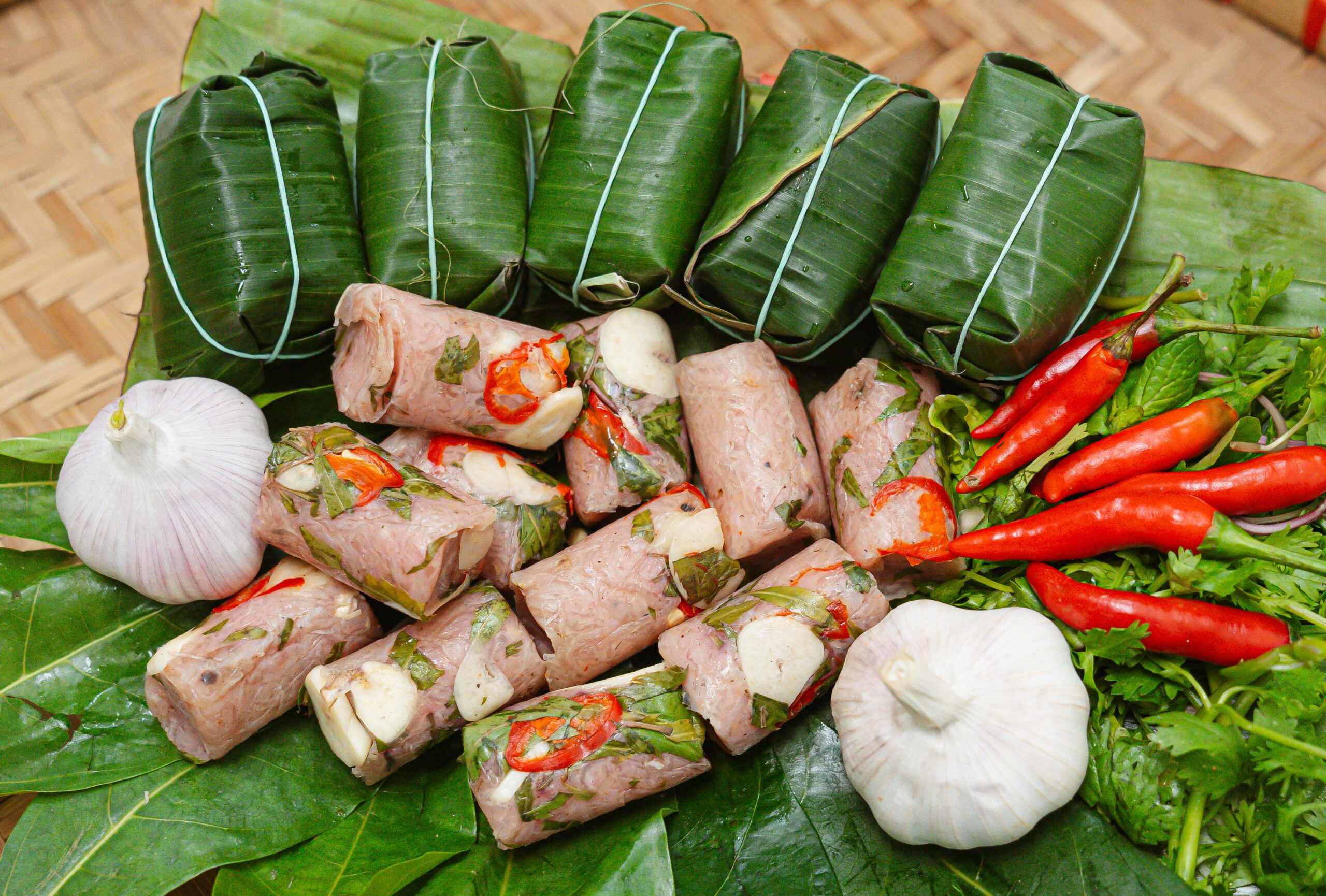 Nem Chua (Thanh Hoa’s signature fermented pork roll, perfectly balancing sweet, sour, and spicy notes)