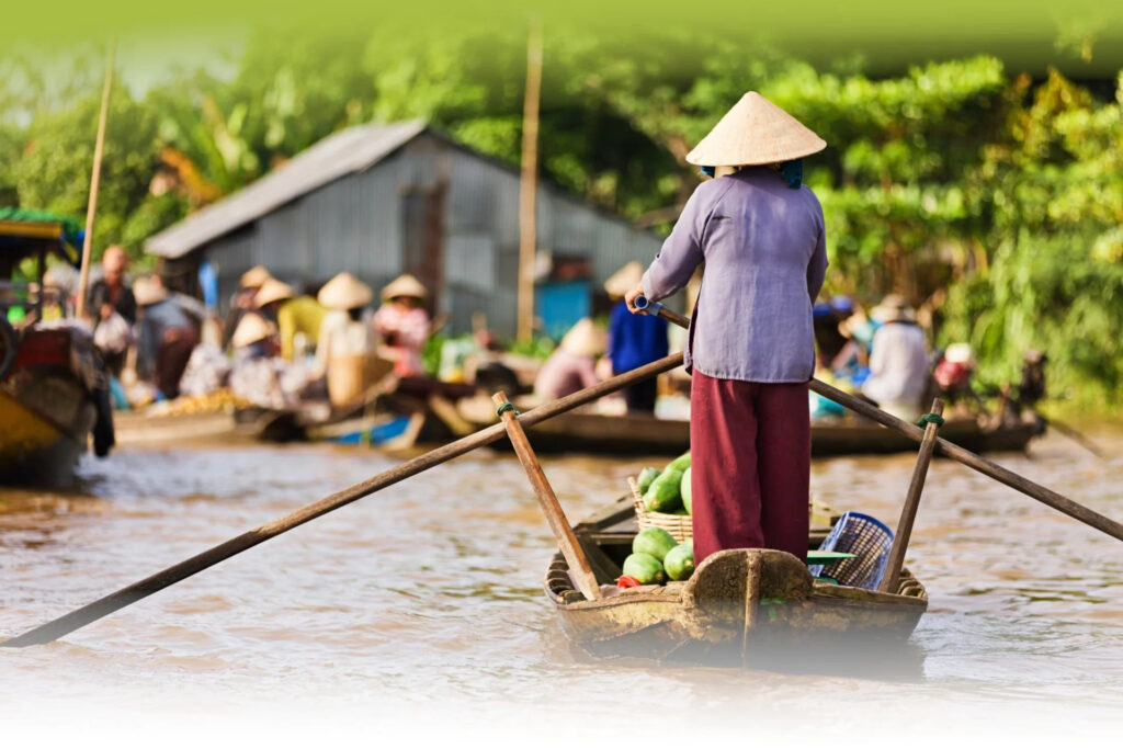 Mekong-river-woman-on-market-boat-faded-viet-nam-fishing-tours
